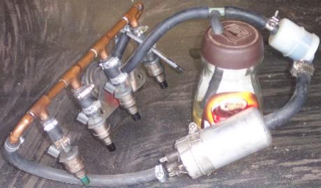 Fuel delivery. The pump, rail, injectors, regulator (behind injectors) and makeshift fuel reservoir. Yes, we took the coffee out first. We're not THAT bodgy!